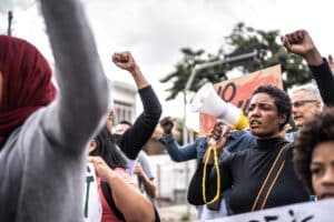 people protesting and holding signs