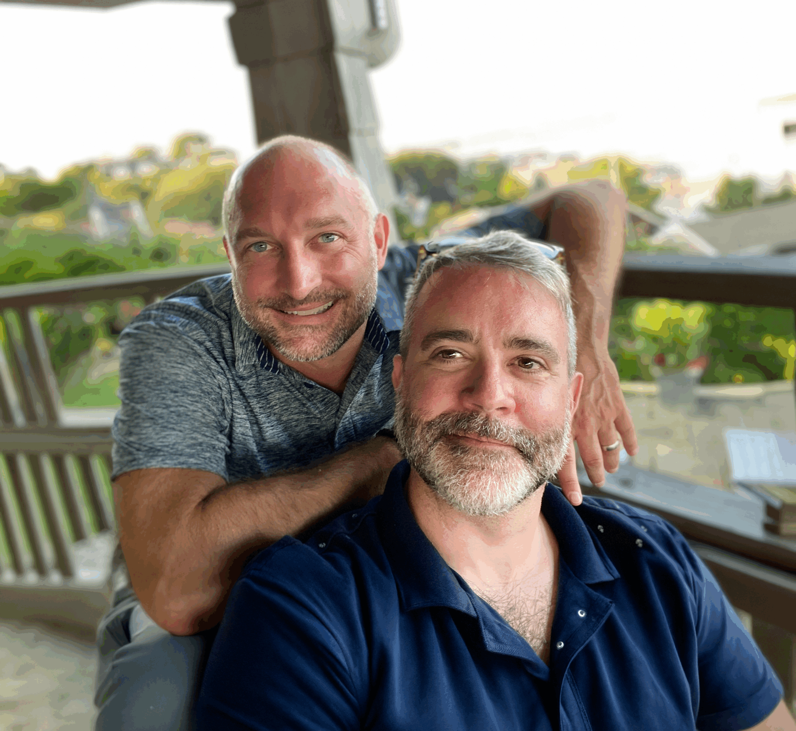 Tristan and Matt, two men sitting on a porch