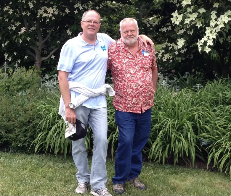 Tim Stein and Wayne Fett outside in a garden