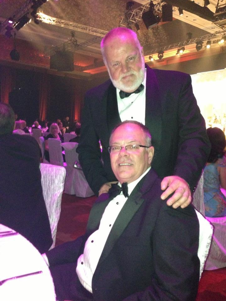 Tim Stein and Wayne Fett in tuxedos at a formal gala event