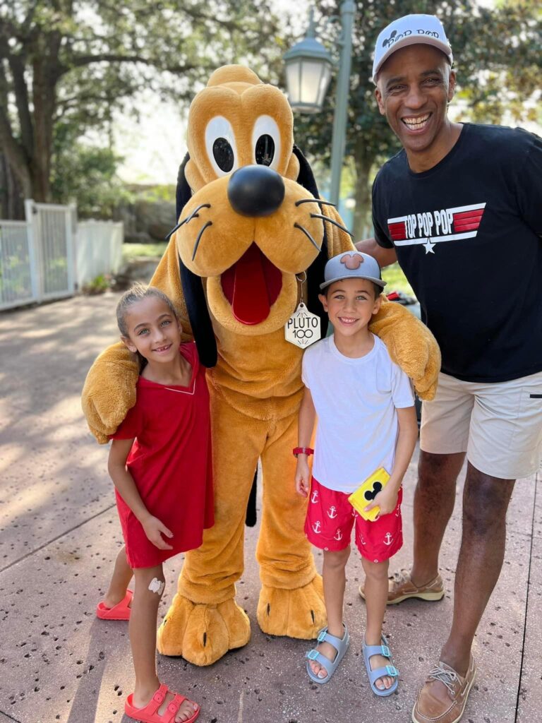 Geoff Worrell with his grandkids and character dressed as Disney's Pluto